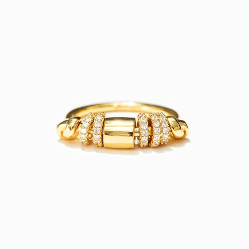 Gold ring with diamond accents on a white background