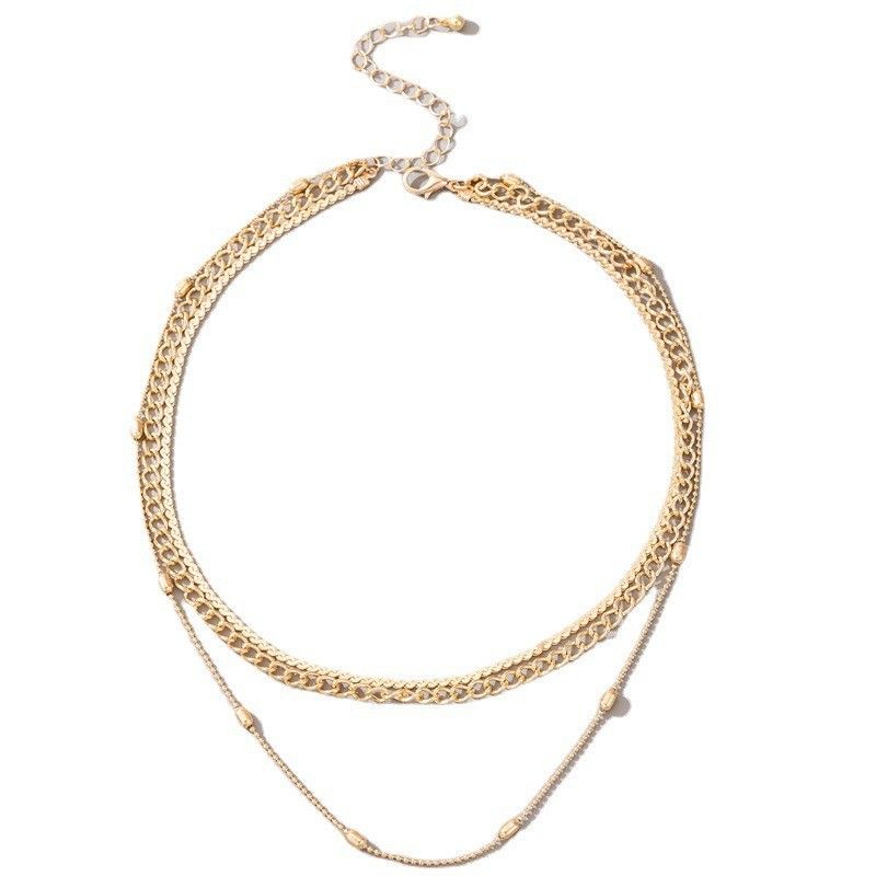 Gold chain necklace on a white background