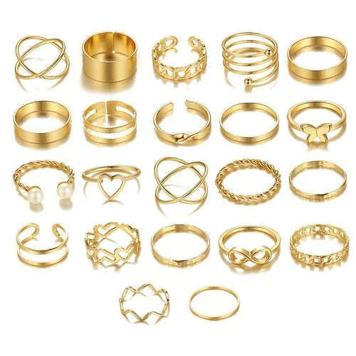 Collection of gold rings on a white background